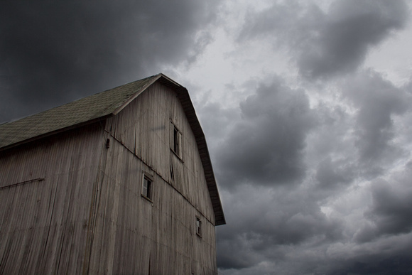 Barn Under Stormy Sky